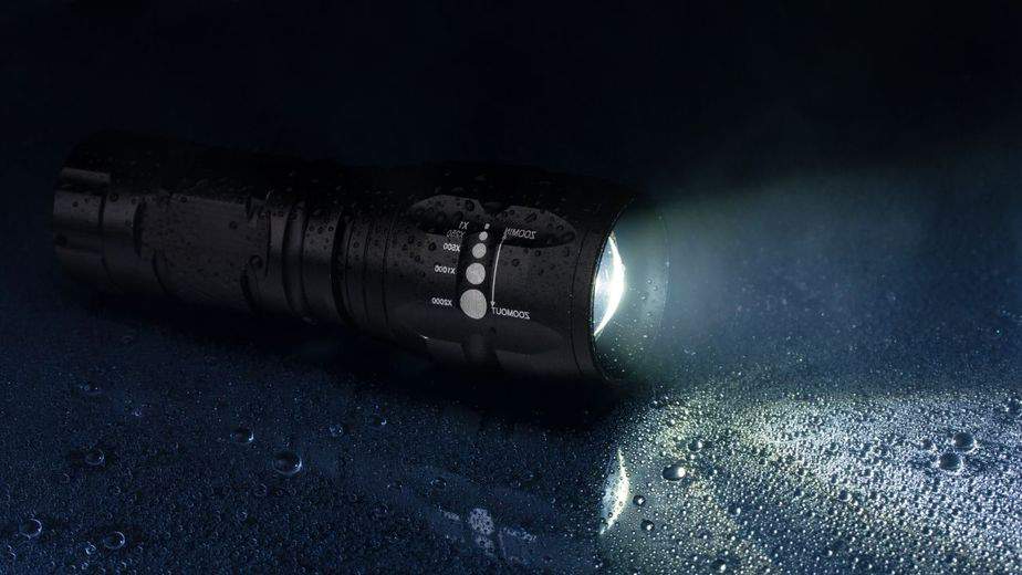 A flashlight is considered tactical if it can disable or disorient an attacker, in this case, a bear
