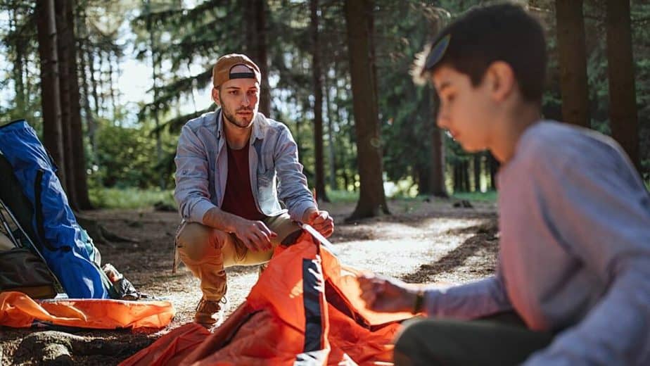 Lay your tent flat on the ground to check for holes where snakes can enter