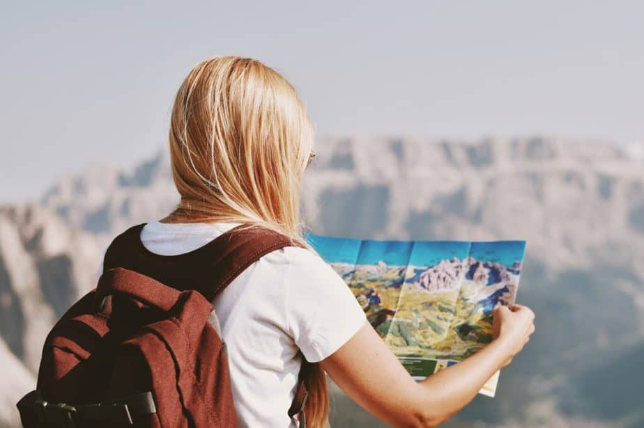 Female hiker holding hiking map