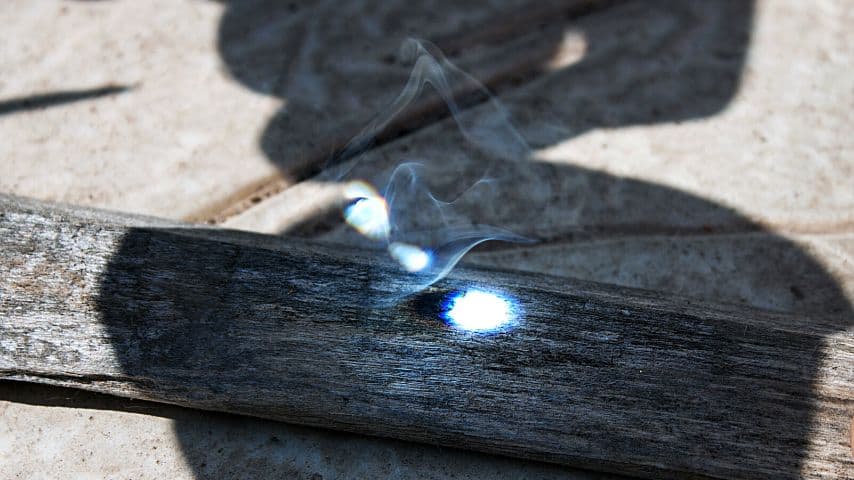 After 20-30 seconds of focusing the sunlight on the tinder, you should see smoke starting to form