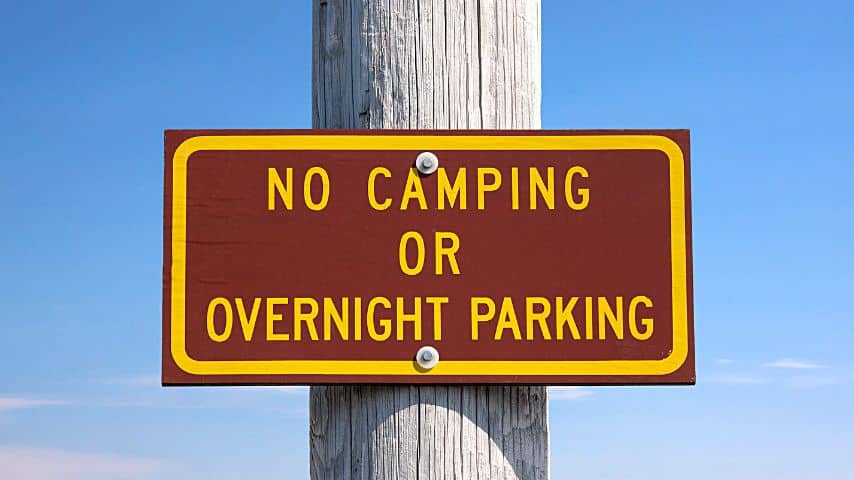 If you see the No Overnight Parking sign on a Walmart store's parking lot, don't try negotiating with a store manager